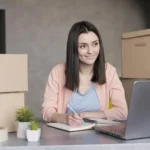 2b95be5c3547275525aa69820c8e1339-2ac72c652de2ece1fe270839962fbddd-woman-looking-laptop-writing-down-orders-deliver (1)